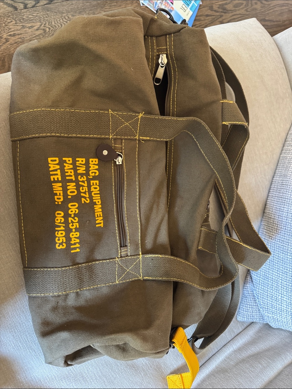Olive Green Military-Style Canvas Duffel Bag with Yellow Stenciled Detail